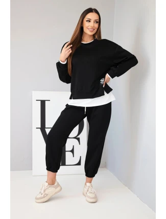 Dámska súprava s maslovou farbou, voľnou mikinou a teplákmi čiernej farby Dámska súprava s maslovou farbou, voľnou mikinou a teplákmi čiernej farby