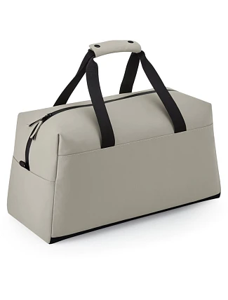 BagBase BG 338 Športová/cestovná taška z matného PU 52.0338 clay BagBase BG 338 Športová/cestovná taška z matného PU 52.0338 clay