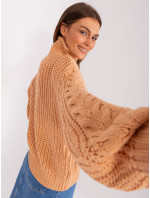 Broskyňový oversize sveter s káblami