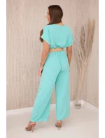 Kombinéza s ozdobným pásom svetlá mentolová