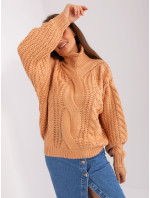 Broskyňový oversize sveter s káblami