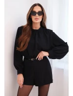 Elegantný dámsky overal s dlhým rukávom a opaskom čierny Elegantný dámsky overal s dlhým rukávom a opaskom čierny