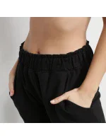 Dievčenské juniorské tepláky JOGGING D0C8P Black - DIM Dievčenské juniorské tepláky JOGGING D0C8P Black - DIM