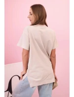 Dámske bavlnené tričko oversize so srdcom a strapcami béžovej farby Dámske bavlnené tričko oversize so srdcom a strapcami béžovej farby
