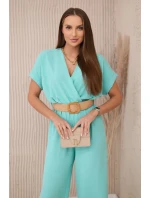 Kombinéza s ozdobným pásom svetlá mentolová