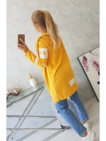 Plášť s horčičným nápisom Plášť s horčičným nápisom