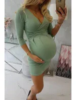 Priliehavé šaty s prestrihom pod prsiami tmavo mätovej farby Priliehavé šaty s prestrihom pod prsiami tmavo mätovej farby