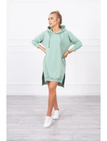 Šaty s kapucňou a dlhším chrbtom tmavo mätové