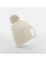 Beechfield B 338R Pletená čiapka Patch „Pompon“ 53.338R ovsená/biela