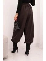 Dámske nohavice so širokými nohavicami a viazaním v spodnej časti hnedej farby