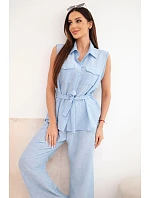 Dámska súprava s uzlovou blúzkou a širokými nohavicami modrej farby